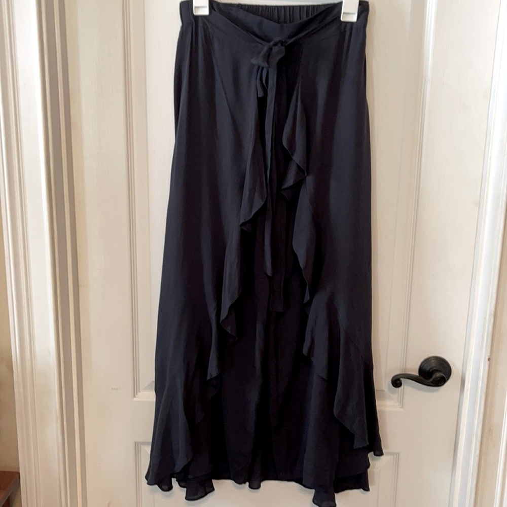 Black pants with ruffled skirt overlay